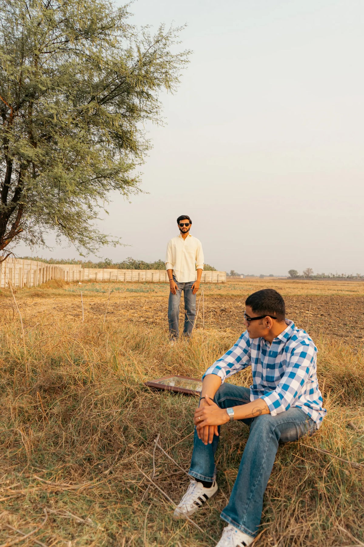 Collage of men in modern casual shirts, including plaid, geometric, white, and yellow styles outdoors